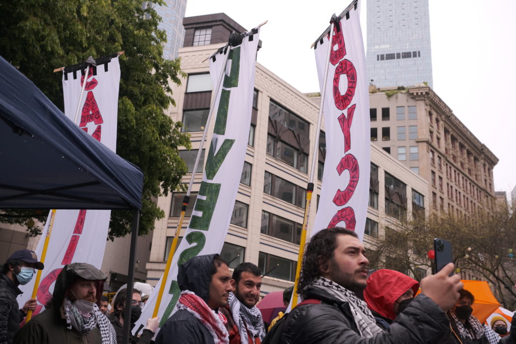 The banners calling for boycotts, divestment, and sanctions.