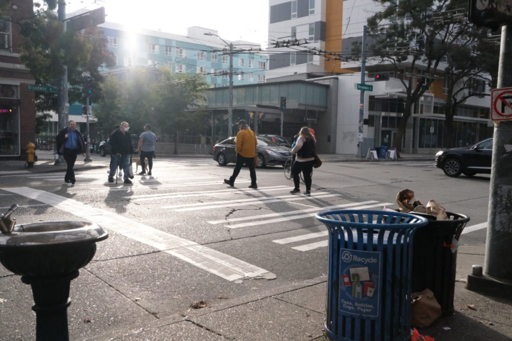 Citizens of the world going about their morning, Broadway and Olive.