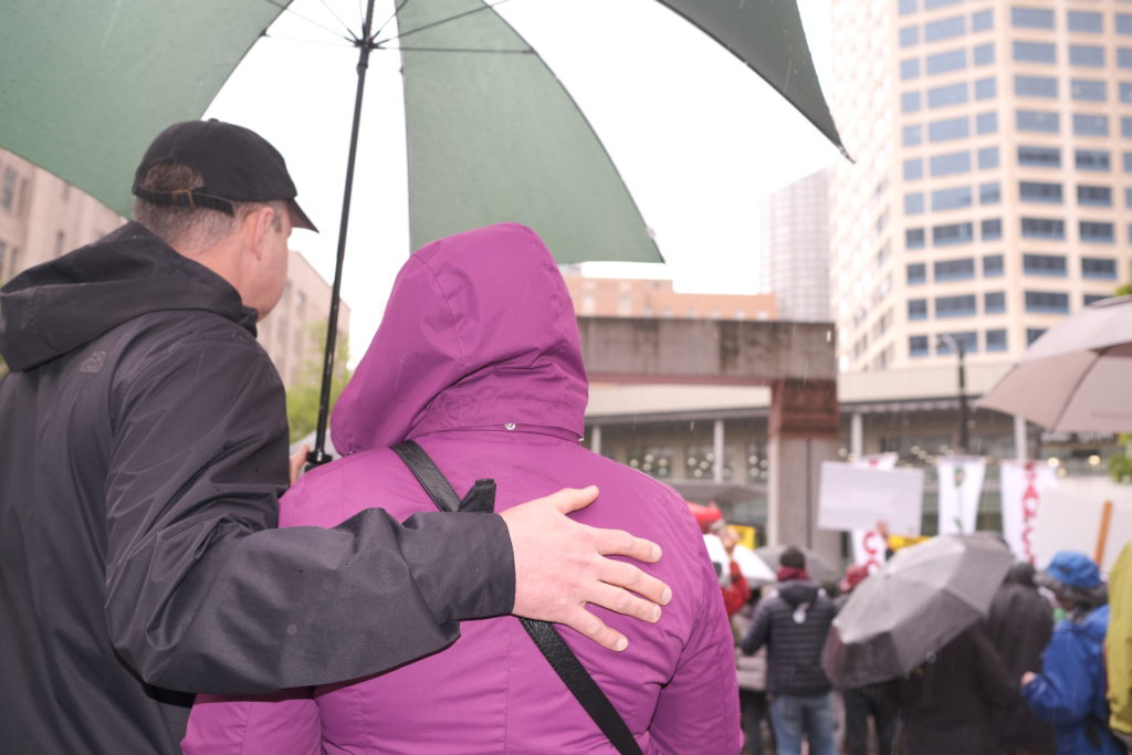 A couple listens to a speech at the rally.