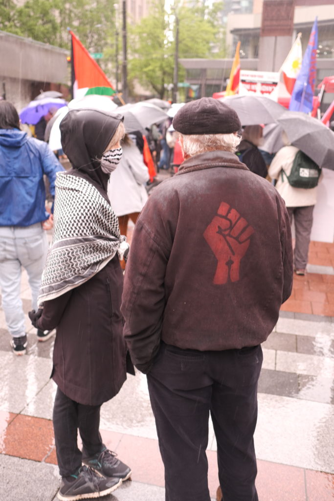 An elderly couple present at the rally.